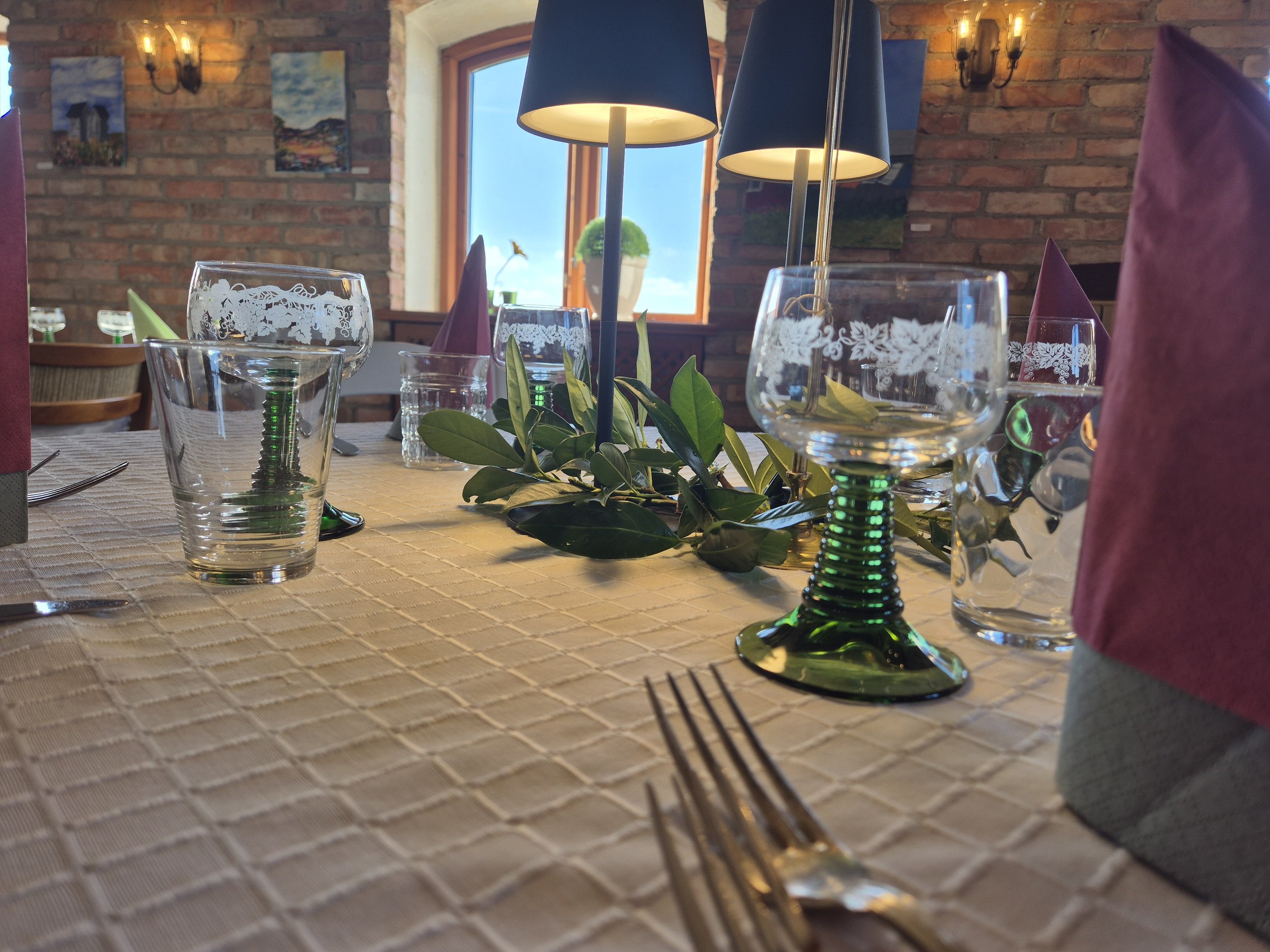 A beautifully arranged wedding reception table features gourmet appetizers, delicate glassware, and pristine white linens. soft lighting creates a warm, inviting atmosphere. ideal for event planning